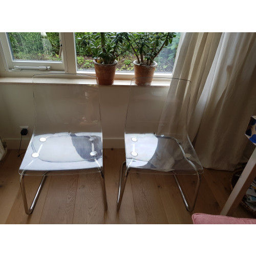 Twee rvs buisstoelen, met tranparante kunststof kuip,  Ikea afbeelding